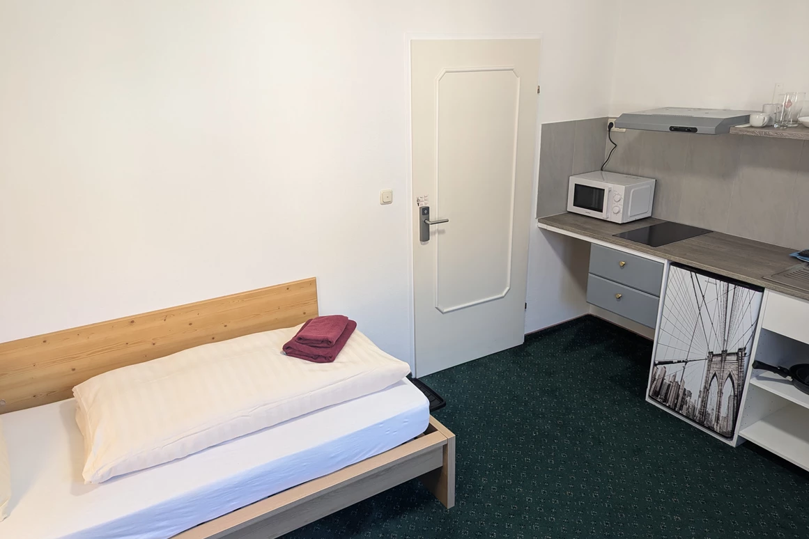 MonteurZimmer: Einbettzimmer mit Küche - Monteurzimmer & Apartments in TOP Ausstattung