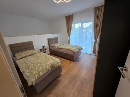 Monteur-Zimmer - Küche - Wien-Stadt - Schlafzimmer (1)  ist mit hochwertigen Boxspringbetten ausgestattet - Imperial Premium Mouteurzimmer