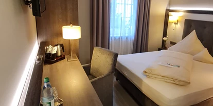 Monteur-Zimmer - Maintal - https://haus-anna-an-der-stadtmauer.de/wp-content/uploads/2020/06/Haus-Anna-Fr%C3%BChst%C3%BCcksraum.png - Haus Anna an der Stadtmauer