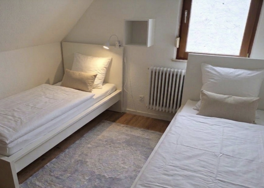 MonteurZimmer: Schlafzimmer 1 - Ferienwohnung Tante Mimi - Haus Frida